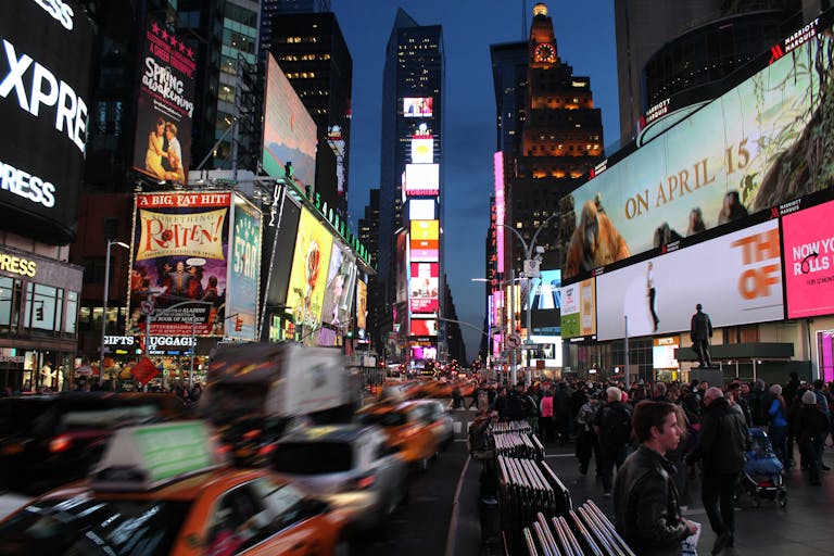 Dynamic night scene capturing the bustling energy and iconic billboards of Times Square, New York City.